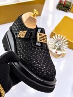Mens Black Textured Leather Loafers With Gold Tone Emblem Strap